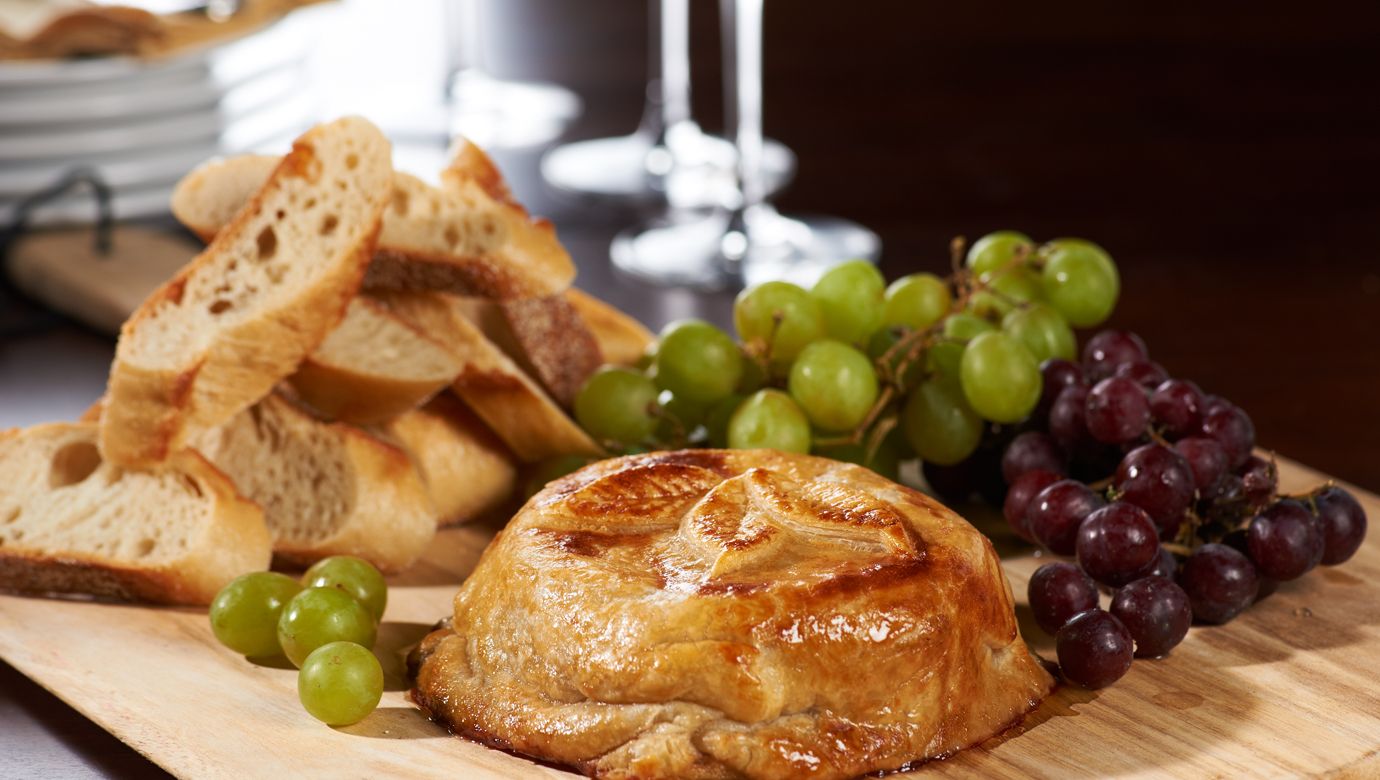 Baked Brie with Raspberry Jam, Almonds, and Cranberries