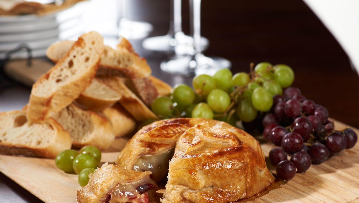 Baked Brie with Raspberry Jam, Almonds, and Cranberries