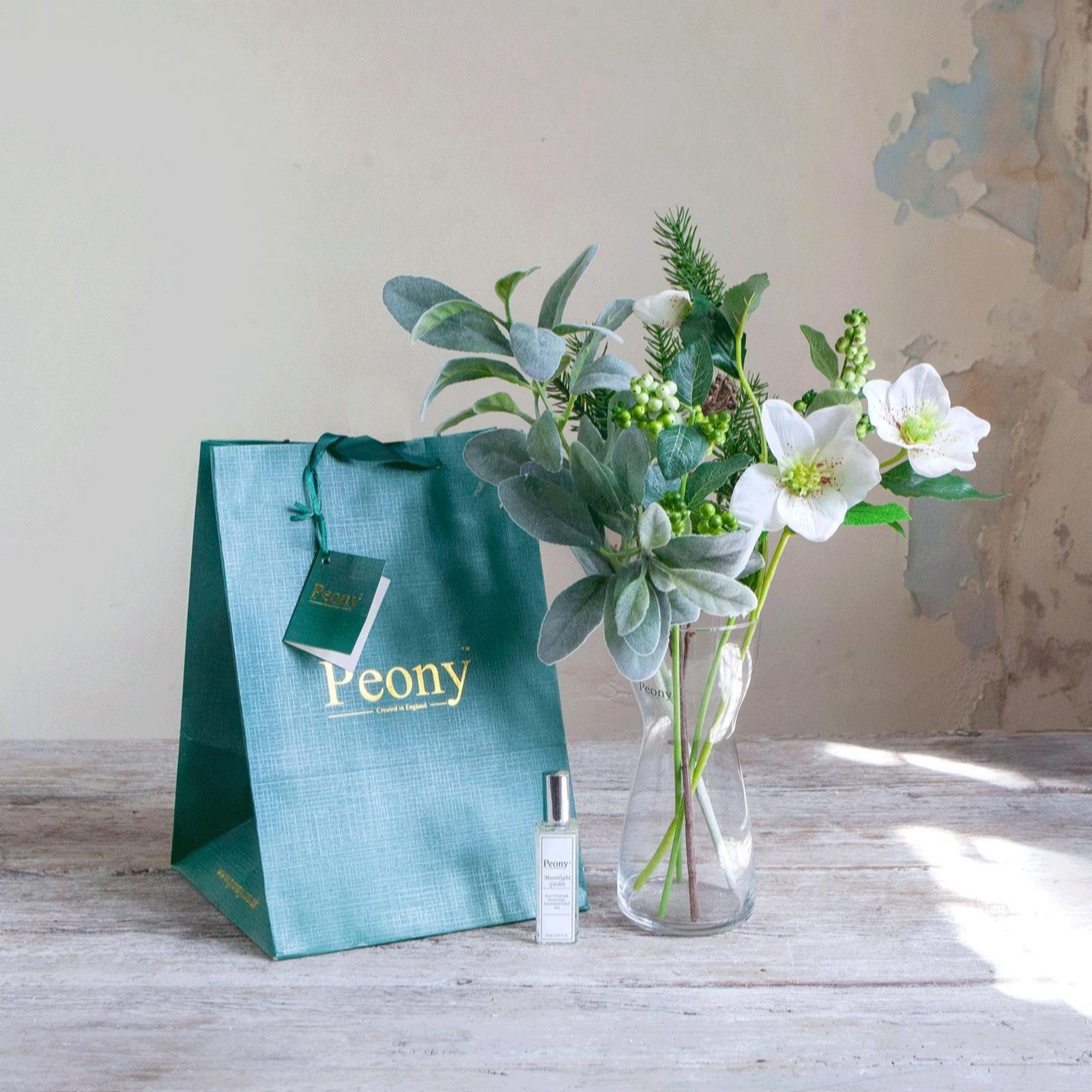 Peony Pink Hellebores, Pine Berries & Foliage In A Vase With Gift